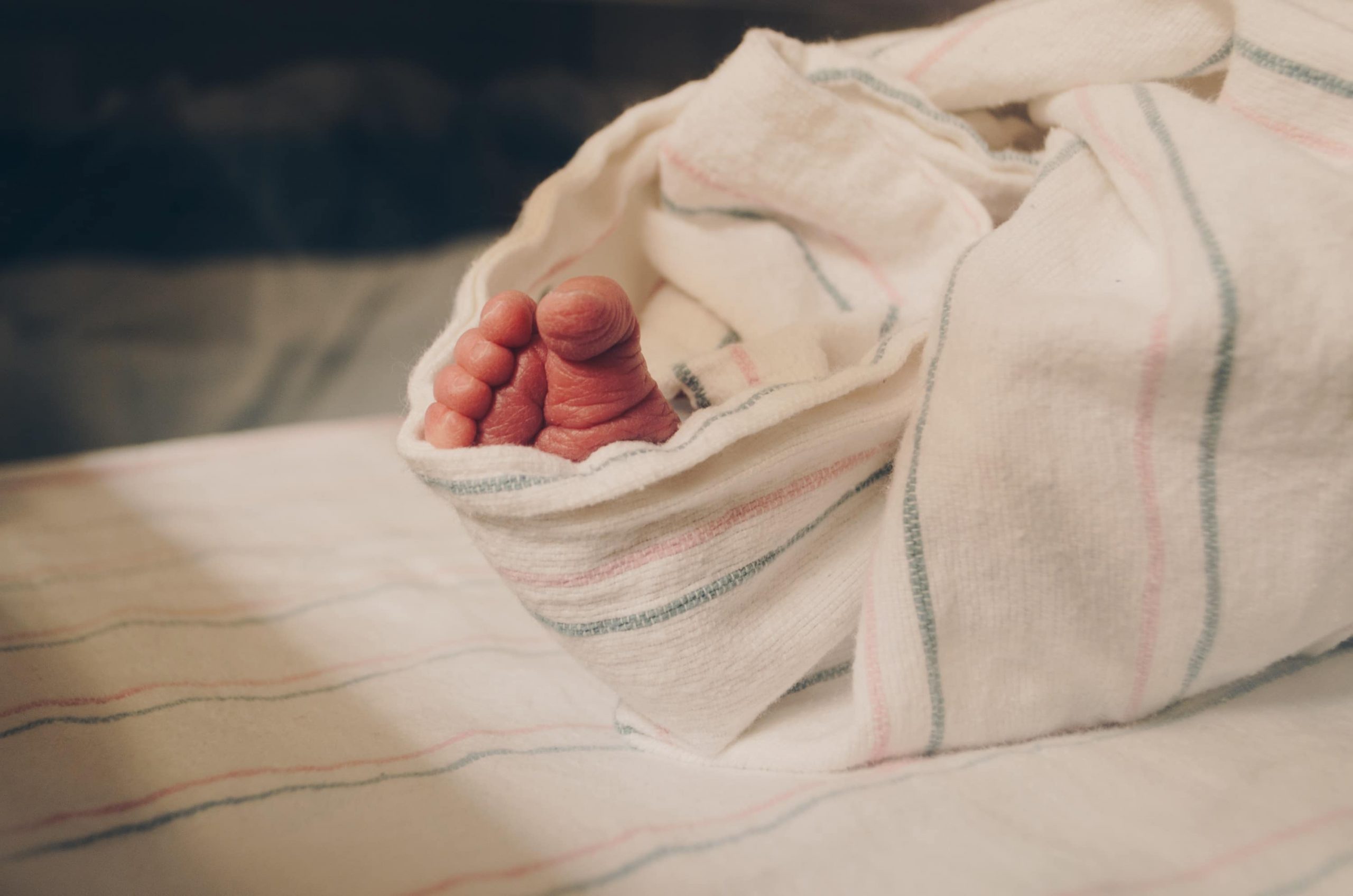 little baby toes in blanket