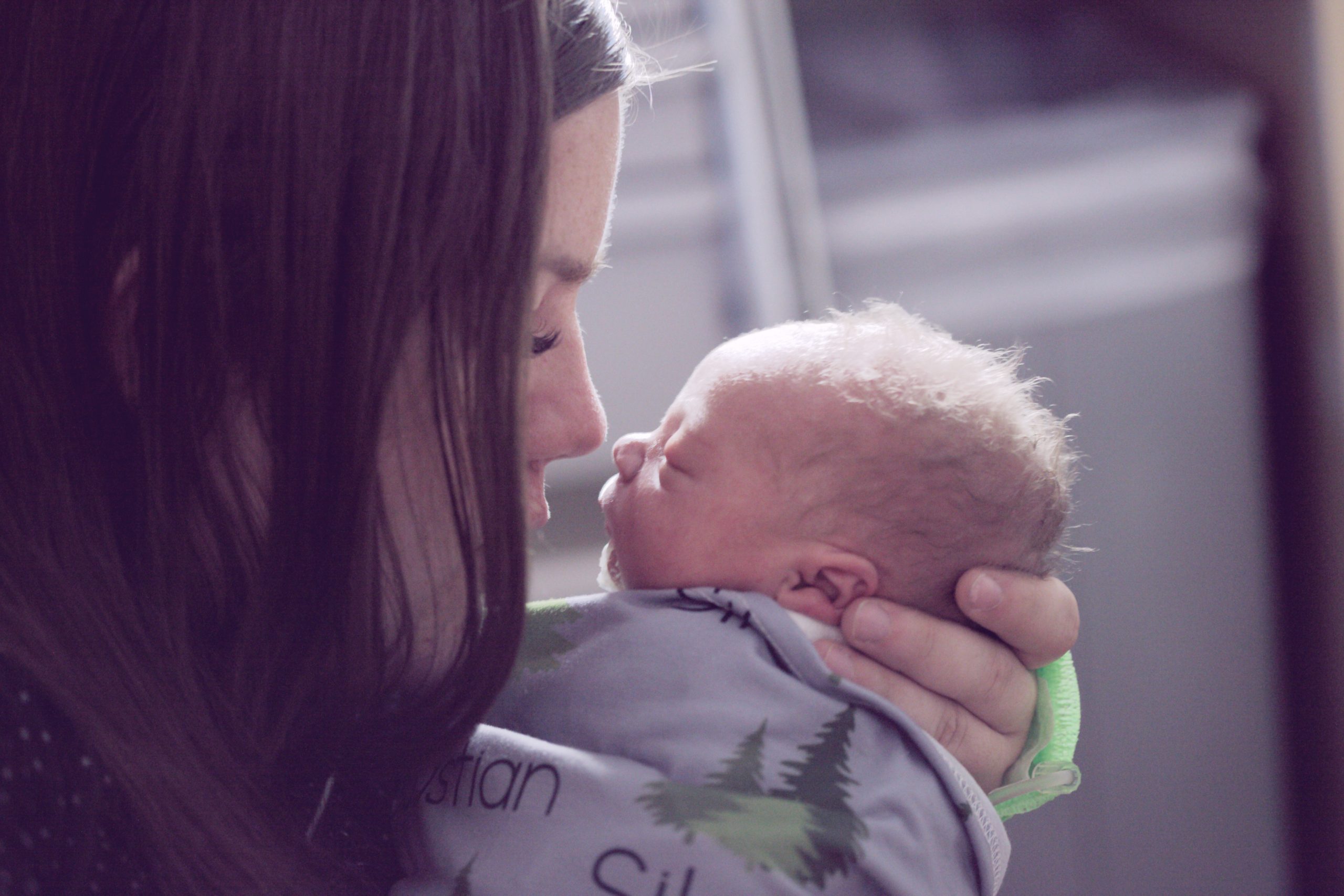 woman holding newborn baby